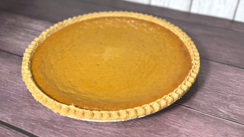 Whole Costco pumpkin pie on table