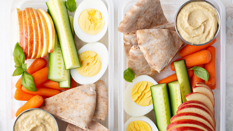 pita chips, carrots, and hummus container