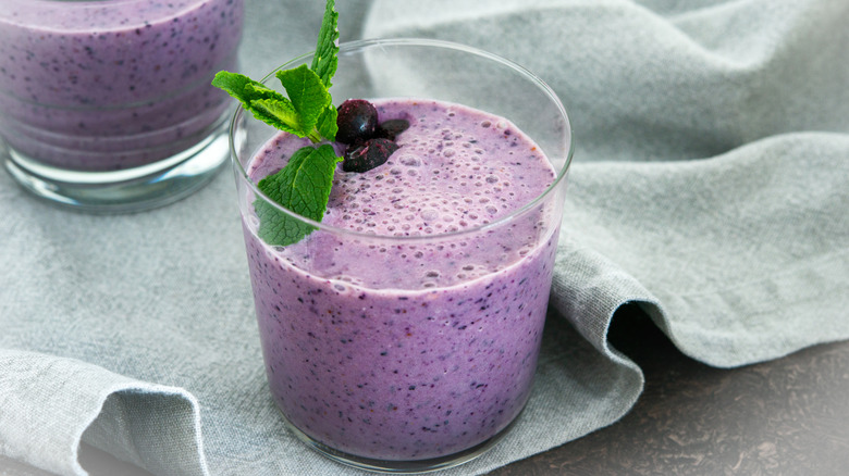 A blueberry smoothie in a glass 