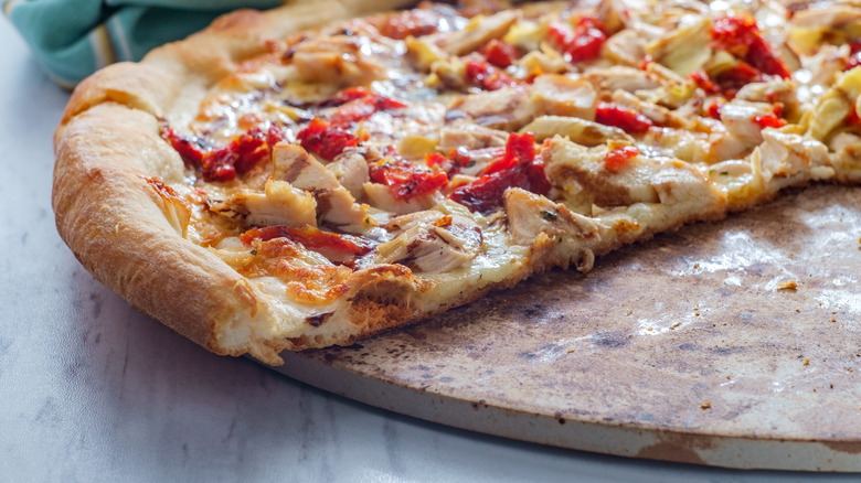 Pizza resting on stone 