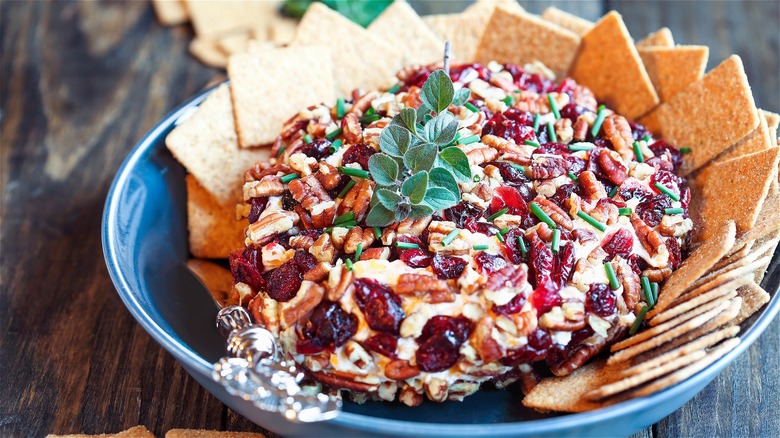 Herb topped cheese ball and crackers