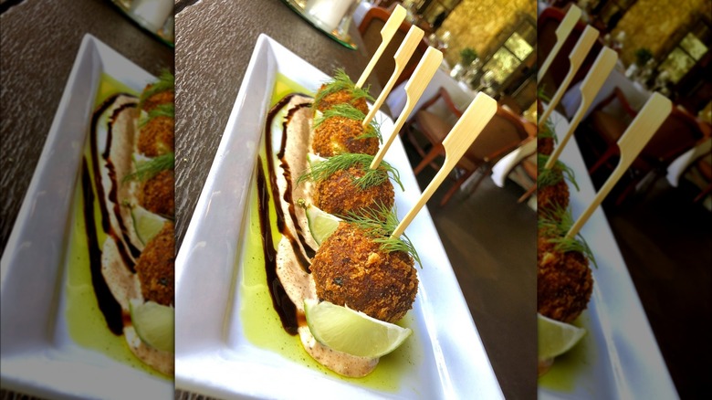 Crab cake hush puppies with garnish