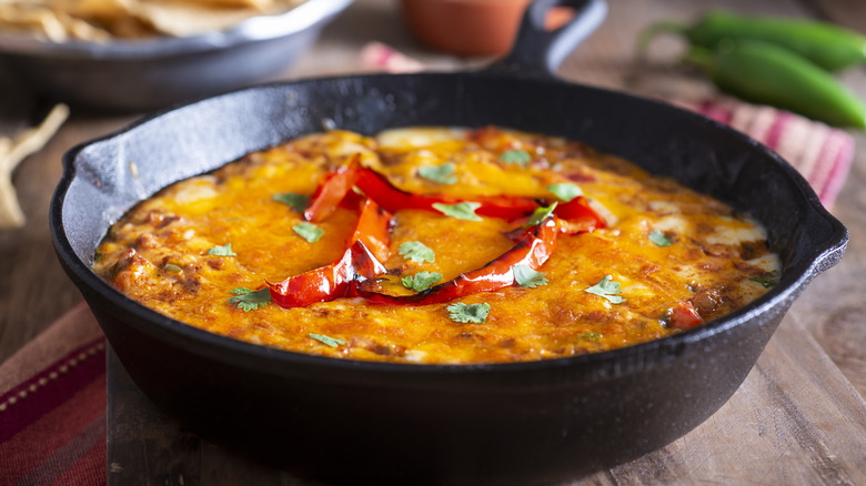 Chili cheese dip in a cast iron pan