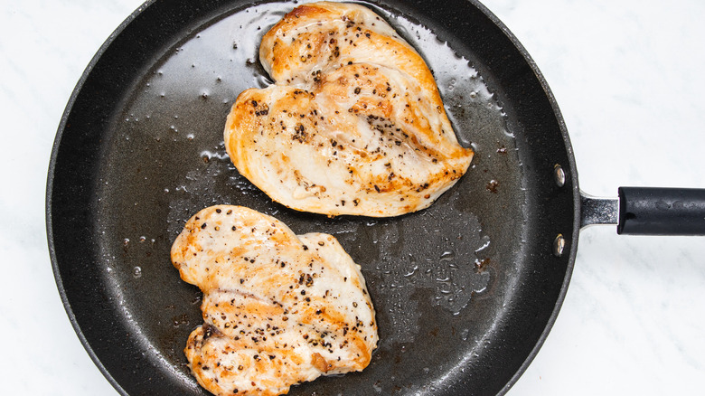 chicken breasts in frying pan
