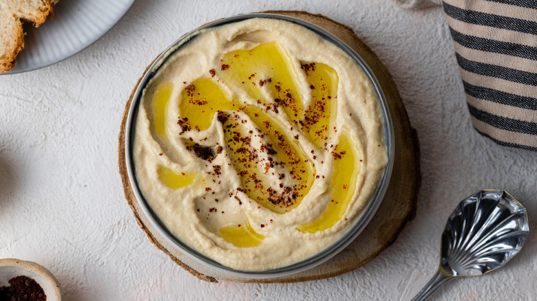 hummus in bowl with spoon