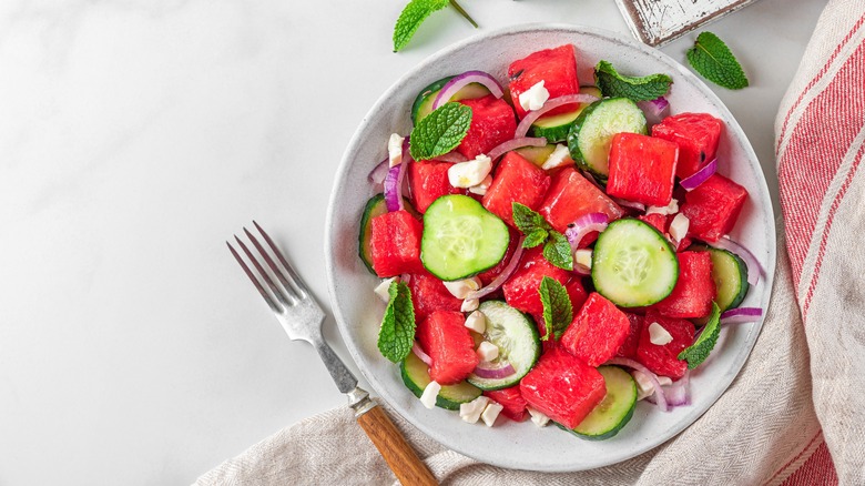 plate of watermelon and vegetable salad