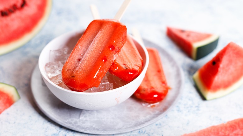 watermelon popsicles in bowl of ice