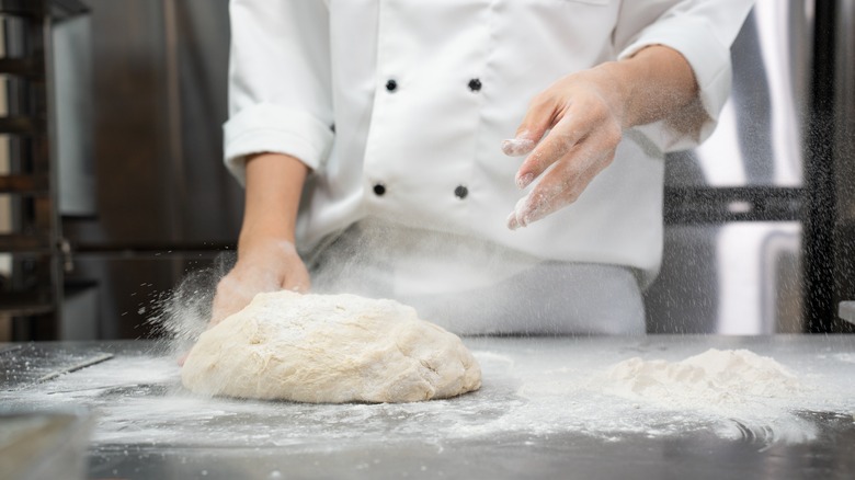 Chef making pizza dough