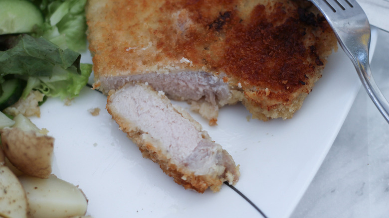 cut-open breaded pork chop 