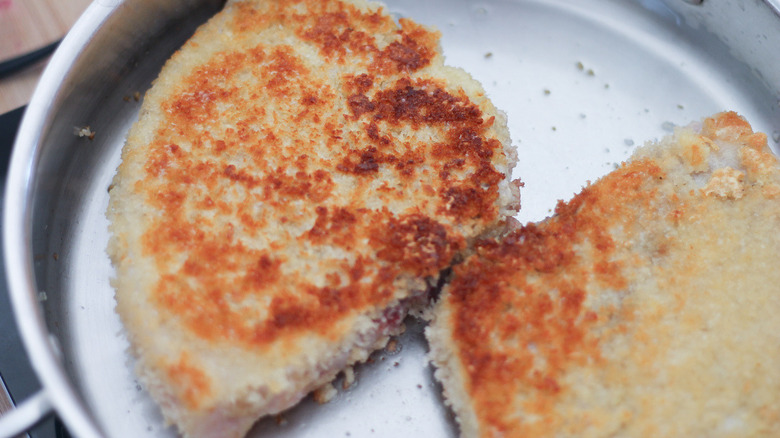 breaded pork chops in pan