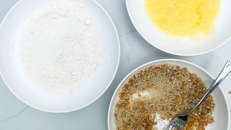 bowls of flour and breadcrumbs for frying