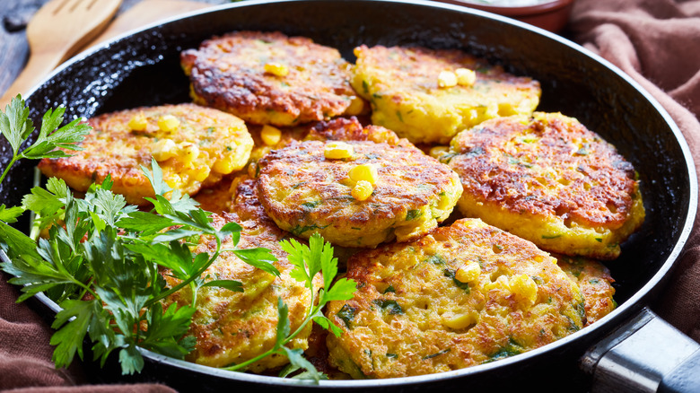 Corn fritters in pan