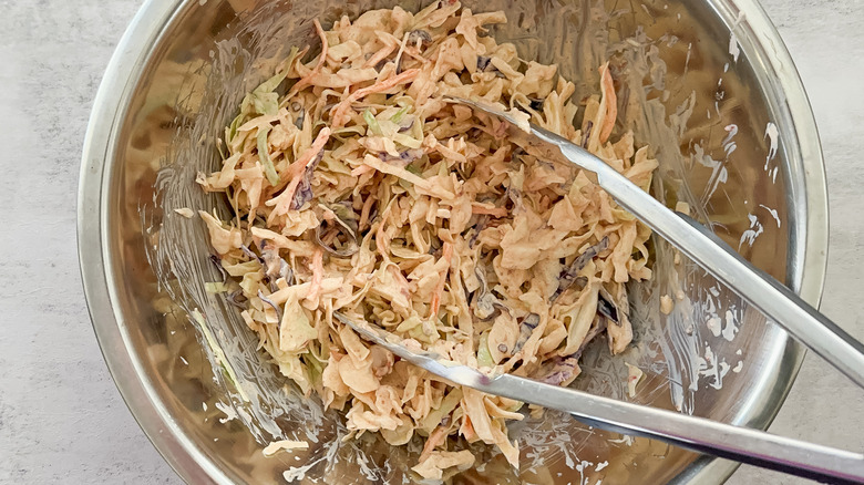 chipotle slaw in bowl with tongs