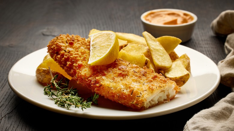 Breaded fried fish on plate