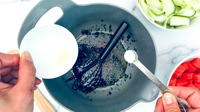 salt going into salad dressing