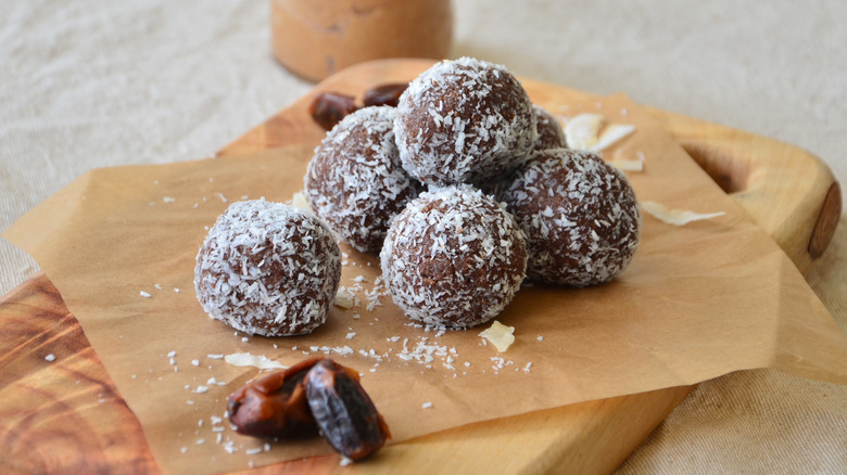 Peanut butter energy balls with dates and coconut flakes