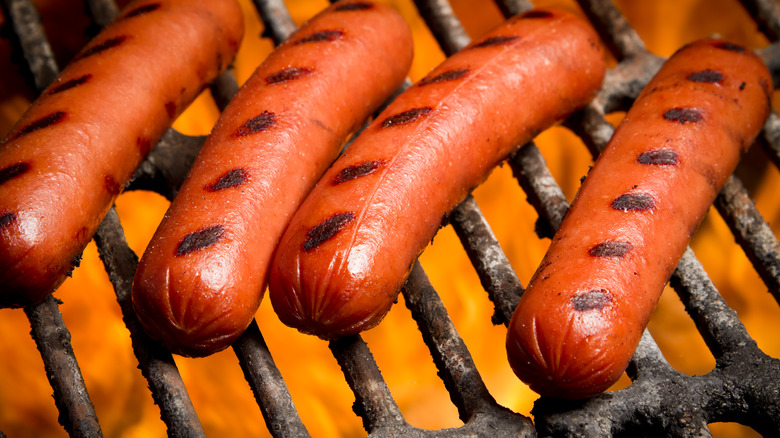 hot dogs on a grill