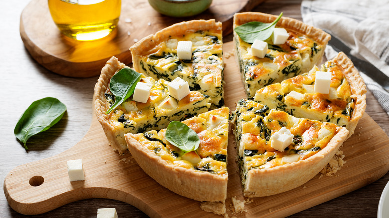 Spinach quiche on cutting board