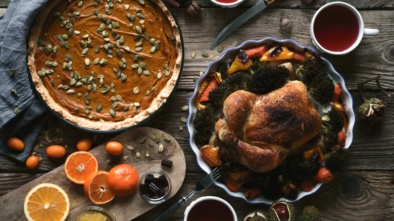 table spread with chicken pie and tea