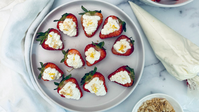 cheesecake stuffed strawberries on plate