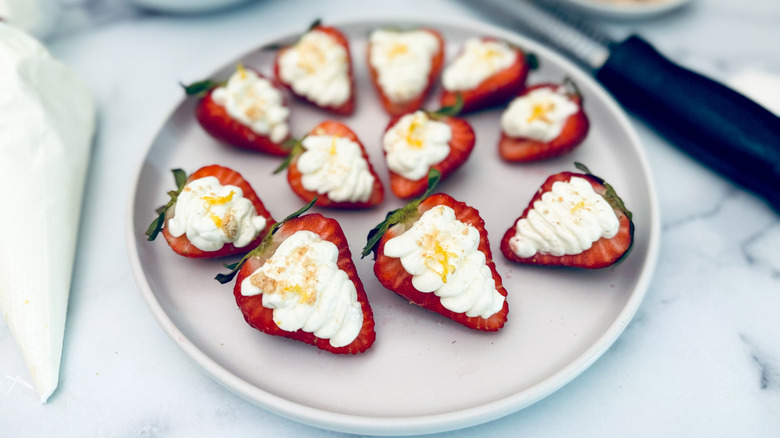 cheesecake stuffed strawberries on plate