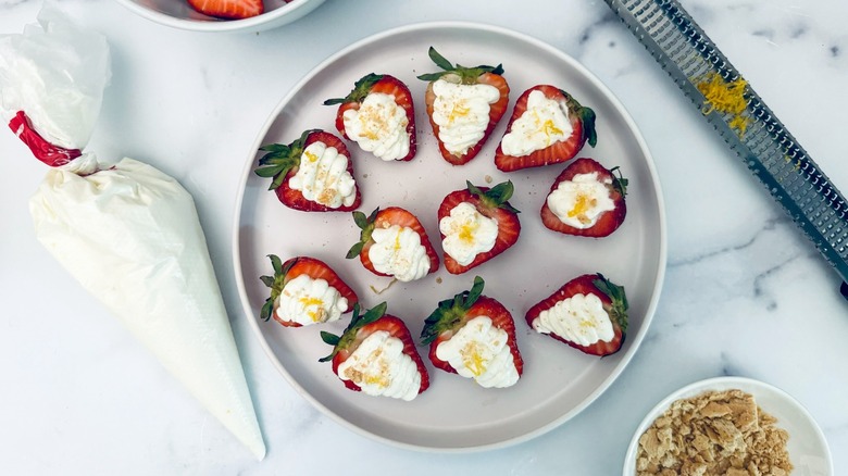 cheesecake stuffed strawberries on plate