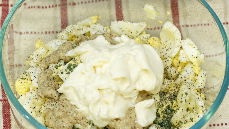 Egg salad ingredients in a bowl