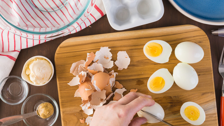 person making deviled eggs