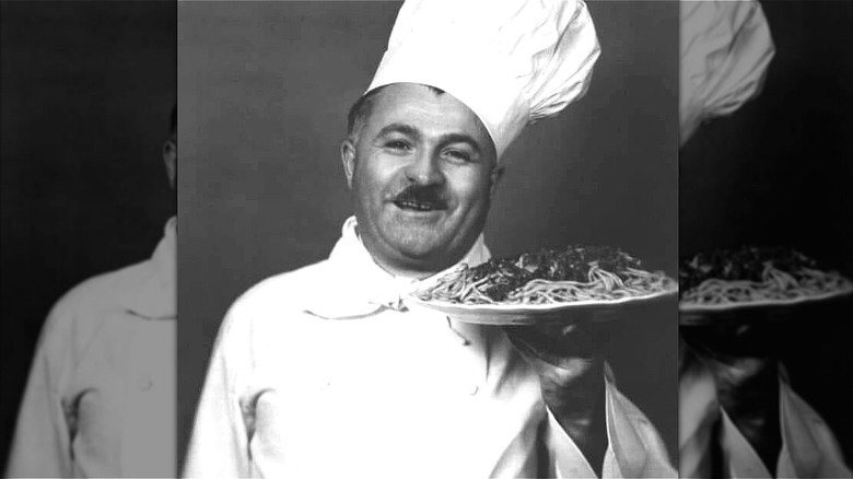 Hector Boiardi holding plate of pasta