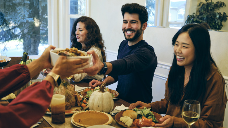 People at Thanksgiving dinner table