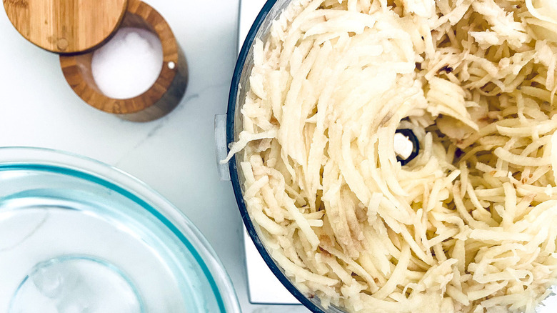 grated potatoes in food processor