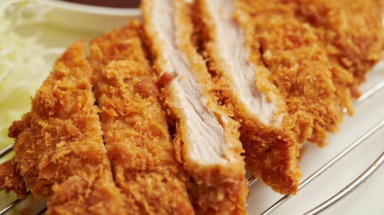 Sliced fried chicken cutlet on a plate