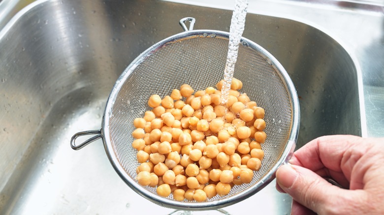 Straining chickpeas in the sink