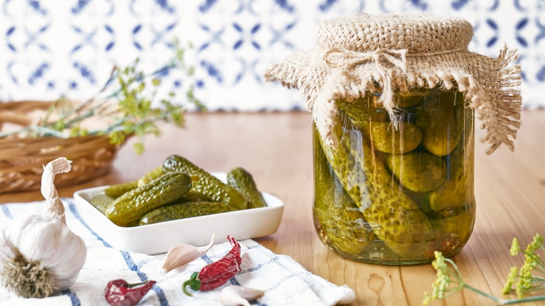 Homemade pickles in a jar on counter 