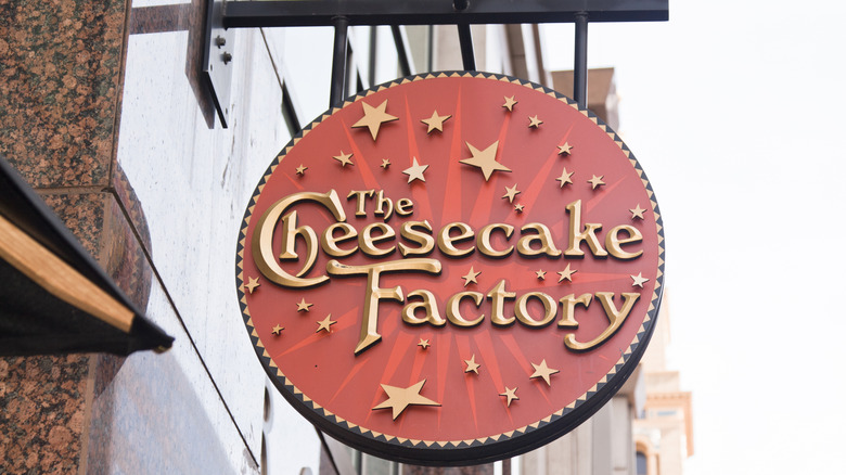 A Cheesecake Factory restaurant sign.