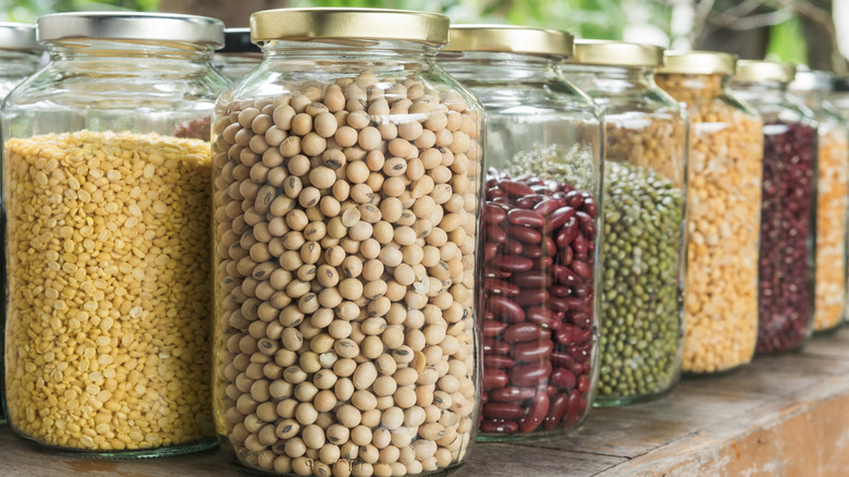 Various dried beans in jars