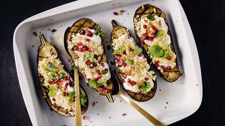 Grilled eggplant halves with pomegranate