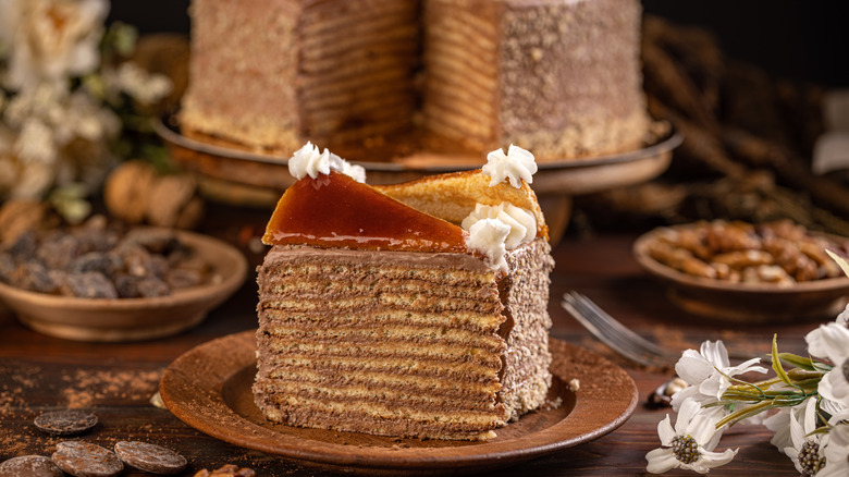 slices of dobos torte on table with cake