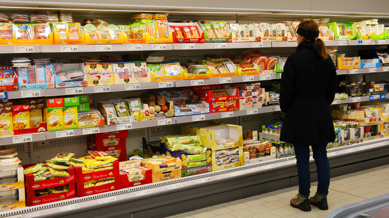 woman looking at groceries