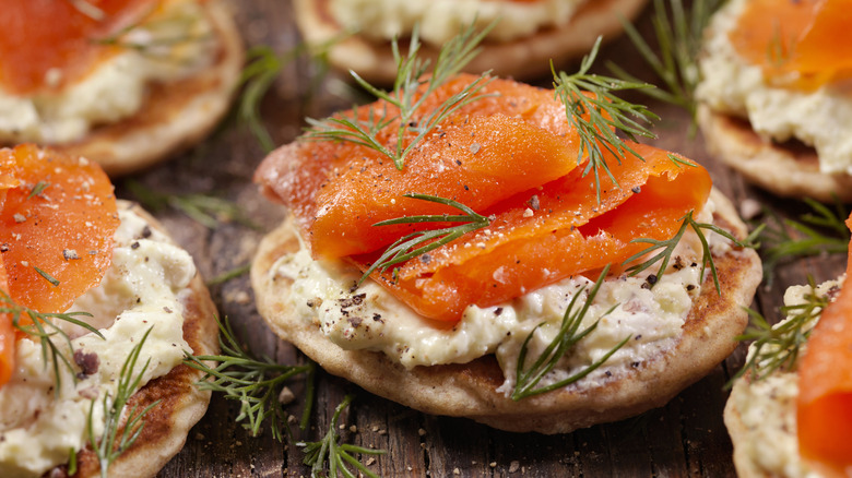 Smoked salmon and dill on crackers with cream cheese