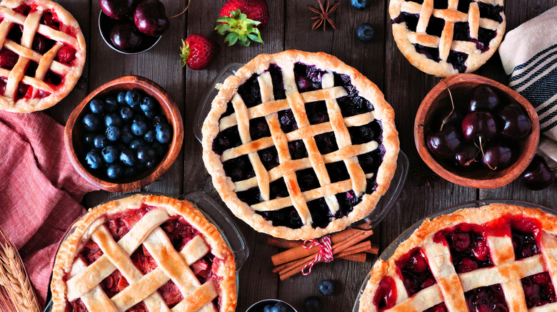 Lattice top fruit pies on table