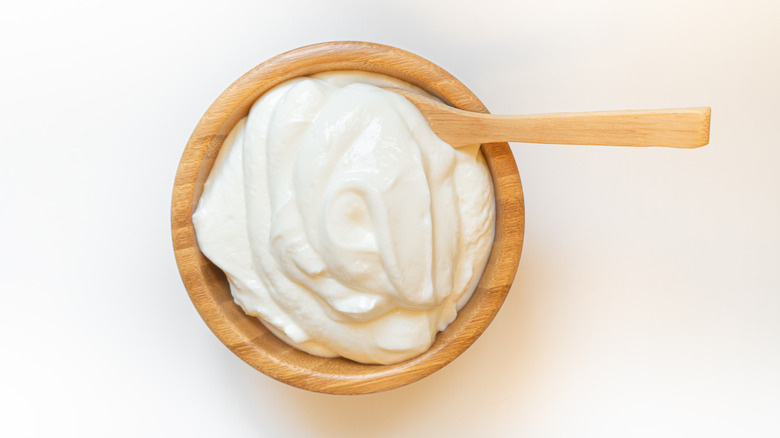 mayo in wooden bowl with wooden spoon