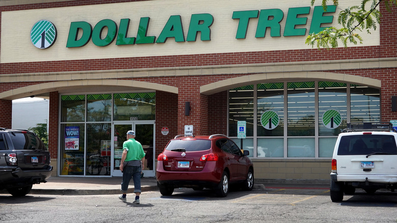 customer walking toward Dollar Tree