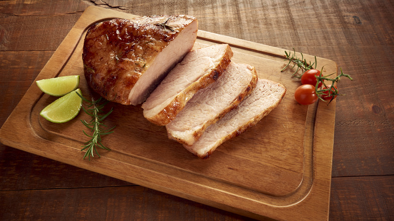 Roast pork on a meat board