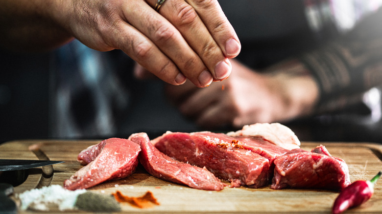 sliced meat on cutting board