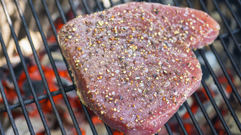 Seasoned tuna steak on a grill