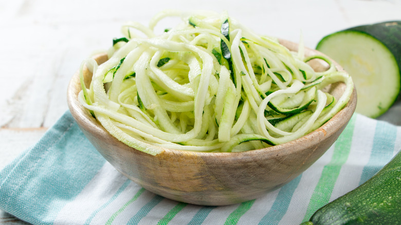 zucchini noodles in wood bowl