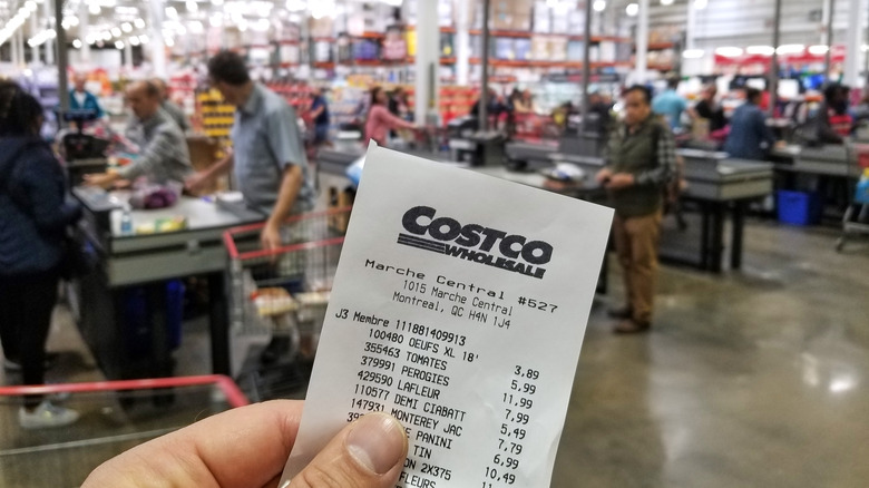 hand holding Costco receipt