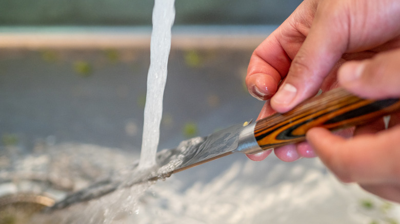 knife washed with running water