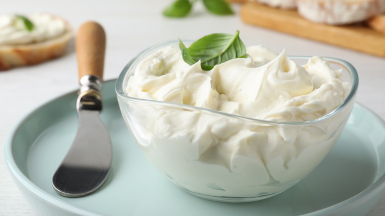 Cream cheese dish with knife